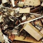 Chairs and wooden desk pieces piled on top of one another